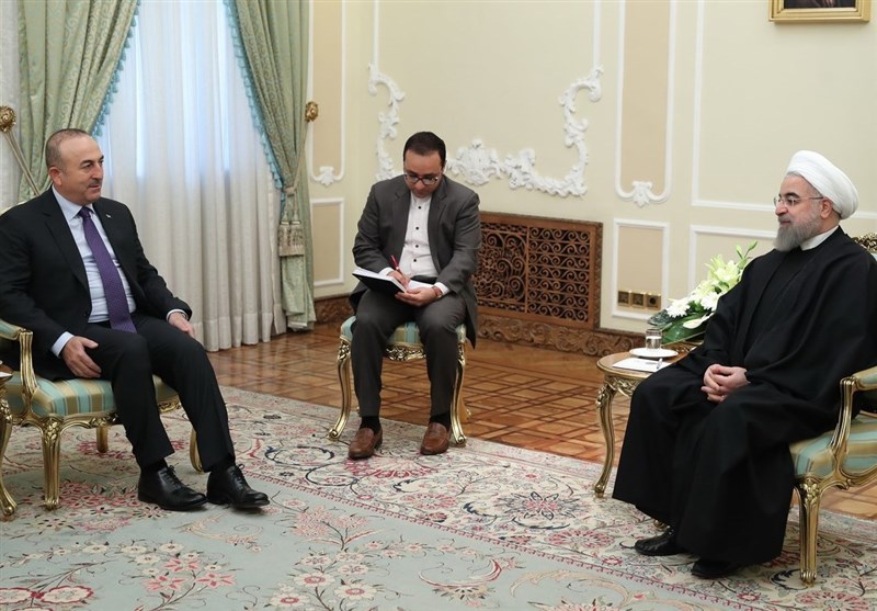 روحاني خلال استقبال وزير الخارجية التركي 