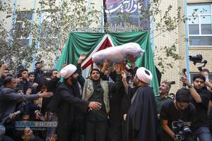 مراسم تدفین پیکر پاک شهید گمنام دفاع مقدس در مدرسه علمیه خواهران حضرت آمنه